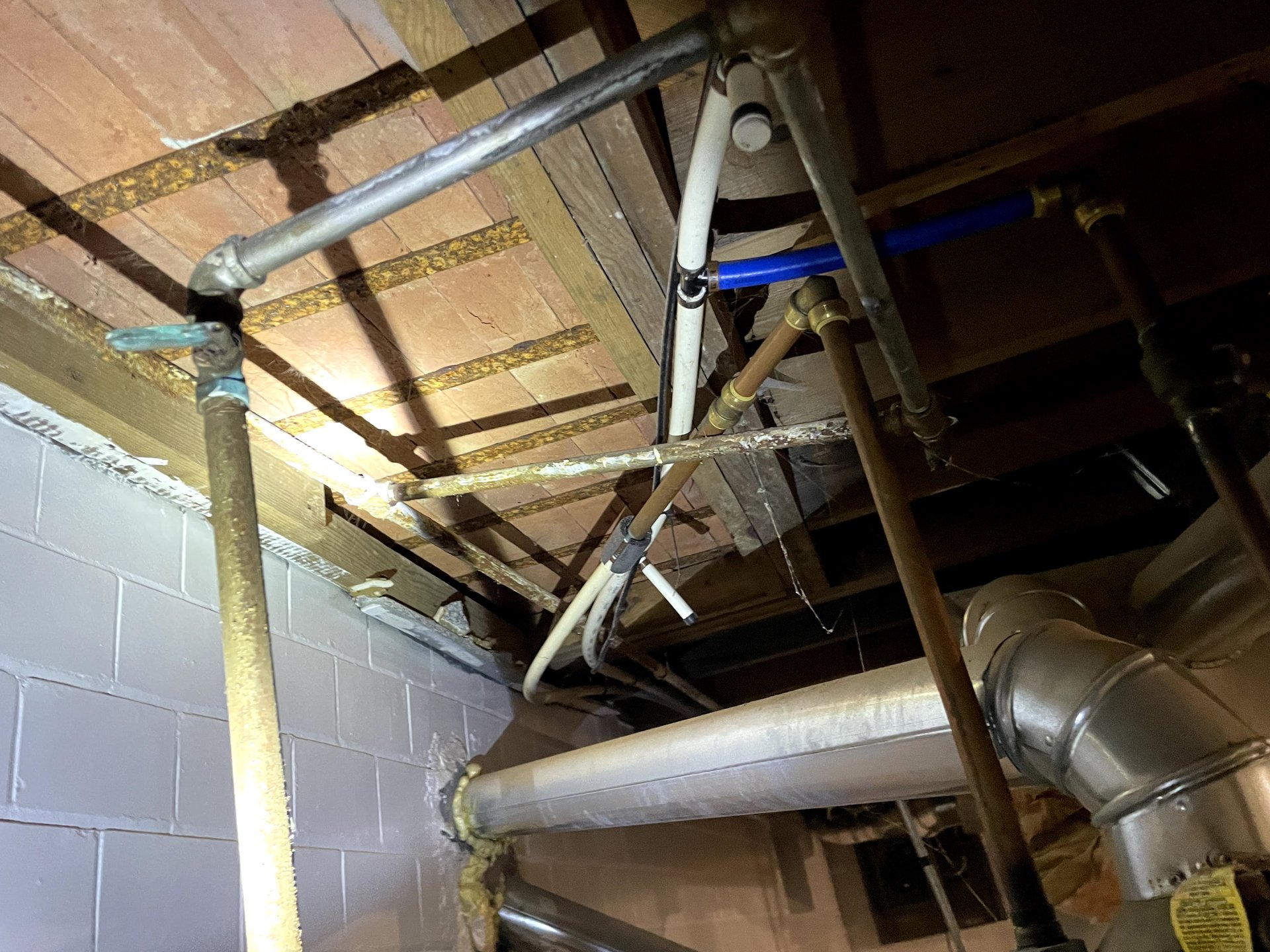 Basement drain pipes with PEX and copper plumbing
