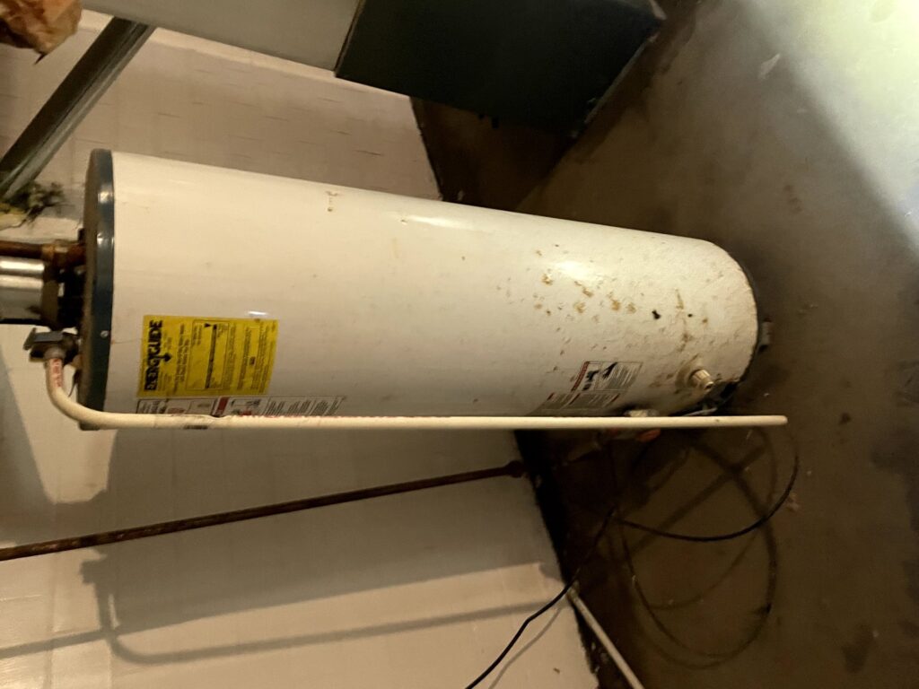 Aging residential water heater in Michigan basement needing replacement
